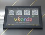 Framed NFC LED social sign with QR codes for Google Reviews, Instagram, Facebook, and WhatsApp.