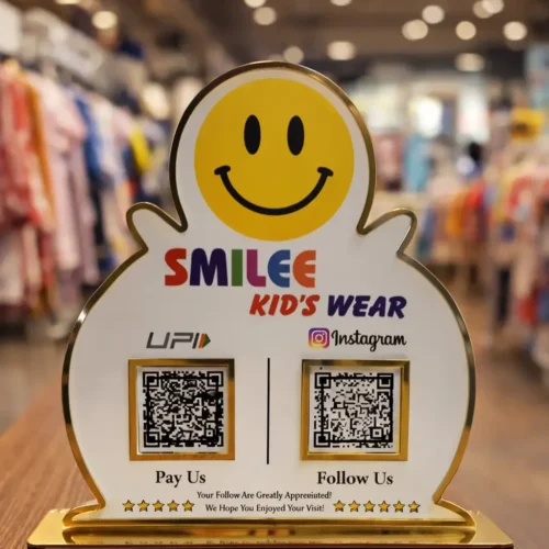 Google review and social media NFC standee in white and gold acrylic with two QR codes on a business counter