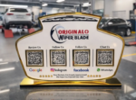 Automotive NFC standee with four QR codes and gold base for reviews, social media, and customer chat on a service counter