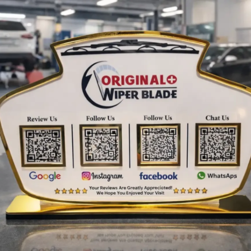 Automotive NFC standee with four QR codes and gold base for reviews, social media, and customer chat on a service counter