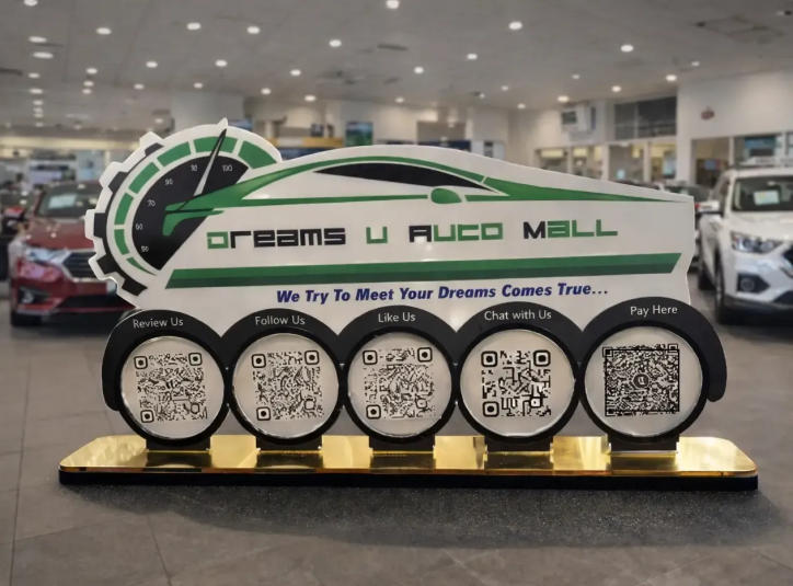 Automotive NFC Standee – 5-in-1 QR Display Automotive NFC standee with five QR codes and gold base for reviews, payments, and customer engagement in a car showroom