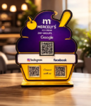 Ice cream–shaped NFC standee with three QR codes for reviews, social media, and payments on a café counter