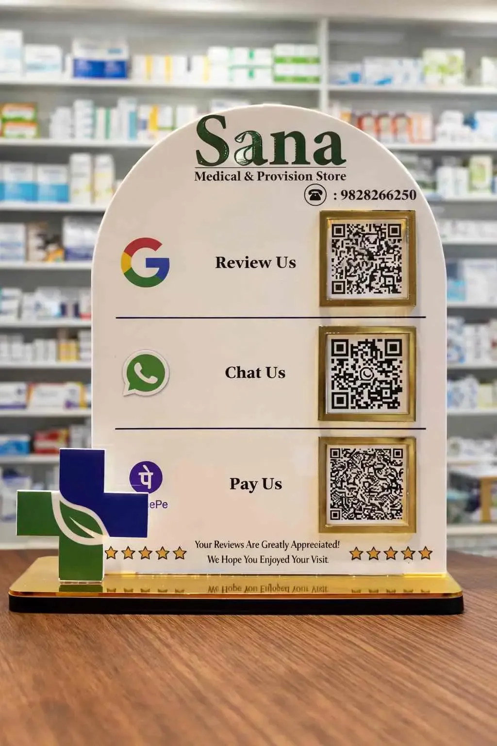 Smart NFC & QR Standee – White & Gold Acrylic Display Smart NFC & QR standee in white and gold acrylic with Google review and contactless payment QR codes on a business counter
