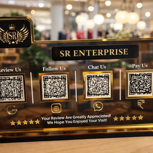 Smart NFC standee with 4 QR codes in black and gold acrylic for reviews, payments, and social media on a business counter