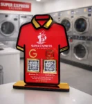 T-shirt shaped laundry NFC standee with Google review and social media QR codes on red acrylic display with gold base